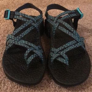 Teal and black chacos